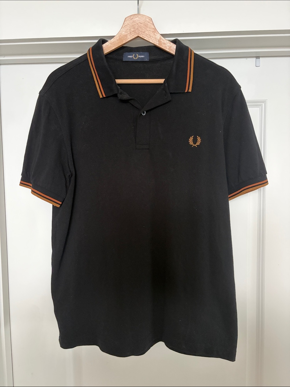 Fred Perry Black Polo with Orange Trim and Laurel Logo